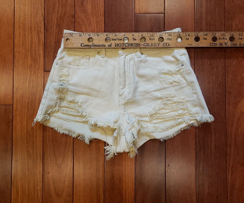 Pac Sun Women's size 26 Mom Short. Light yellow destructed denim jean